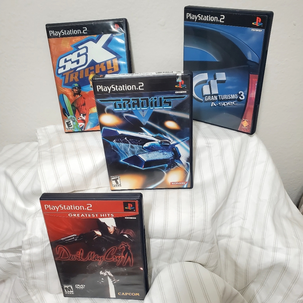 PS2: Devil may Cry. Gladius V. Grand Turismo 3 A-Spec. SSX Tricky.